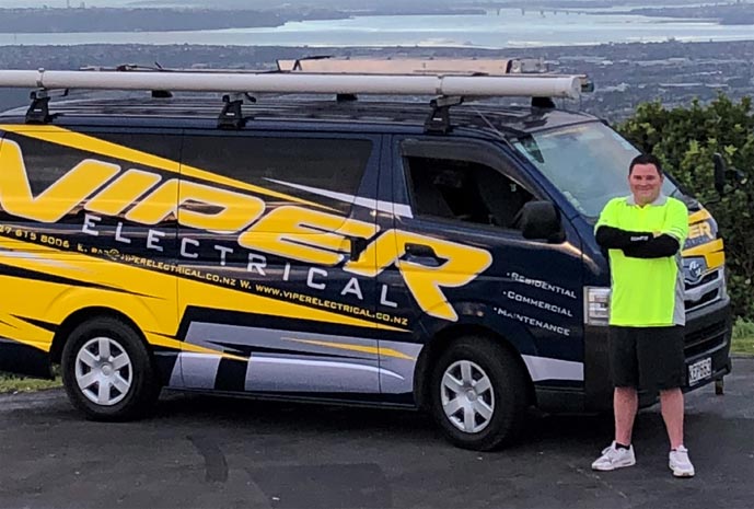 East Auckland electrician standing in front of Viper Electrical van