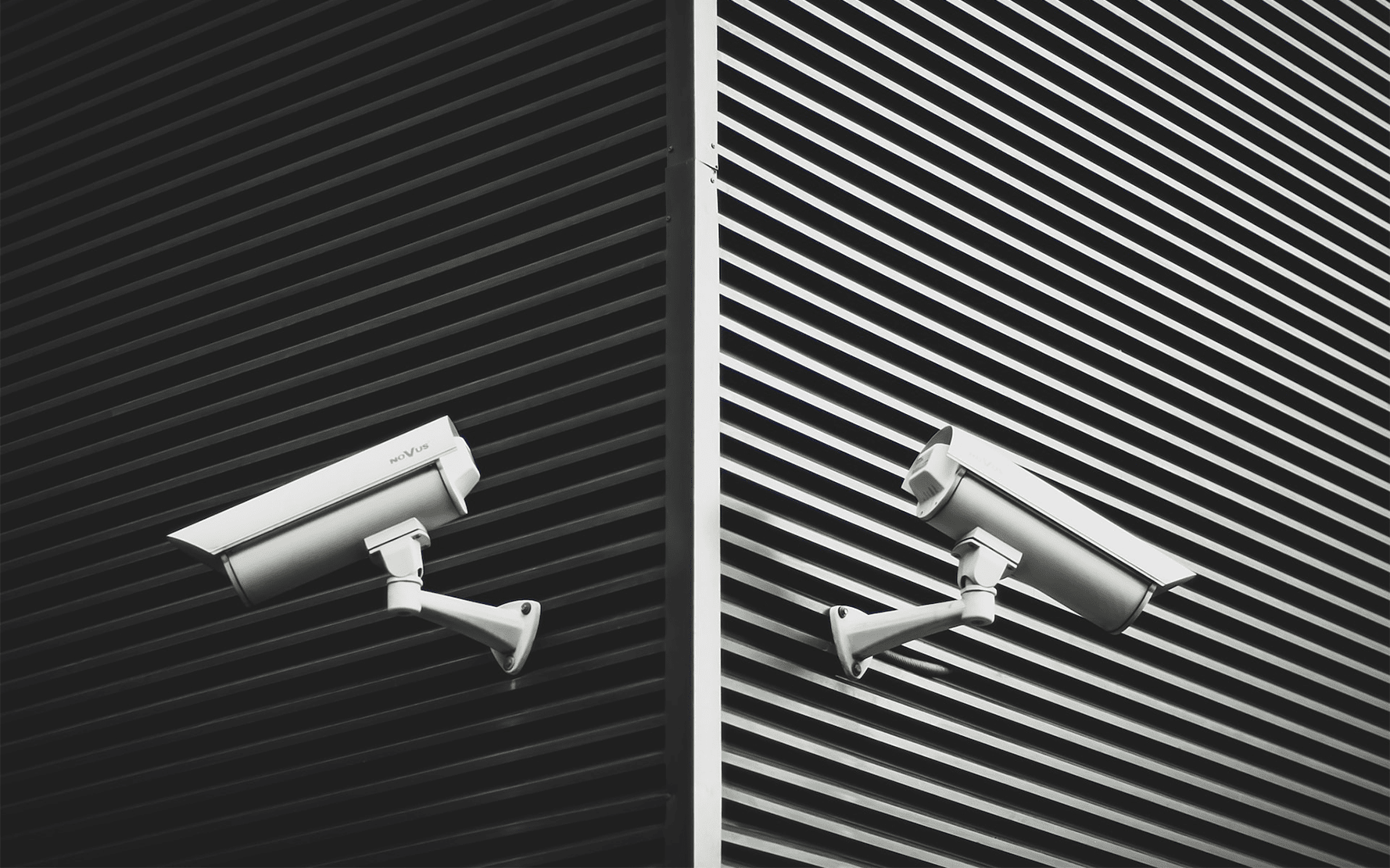 white cctv cameras on building